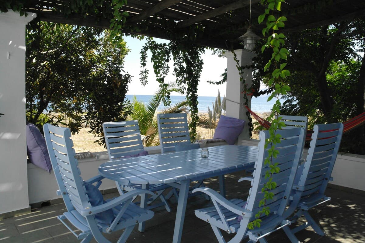 Outdoor dining terrace at Aktìs Alòs